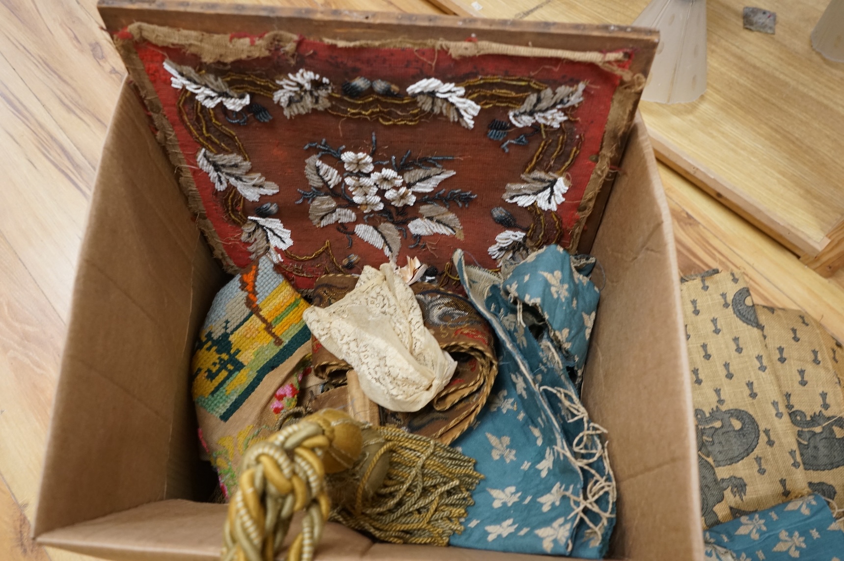A 19th century beadwork panel and bell pull, various samples of printed textiles, a collection of corded and tasselled tie backs, etc.